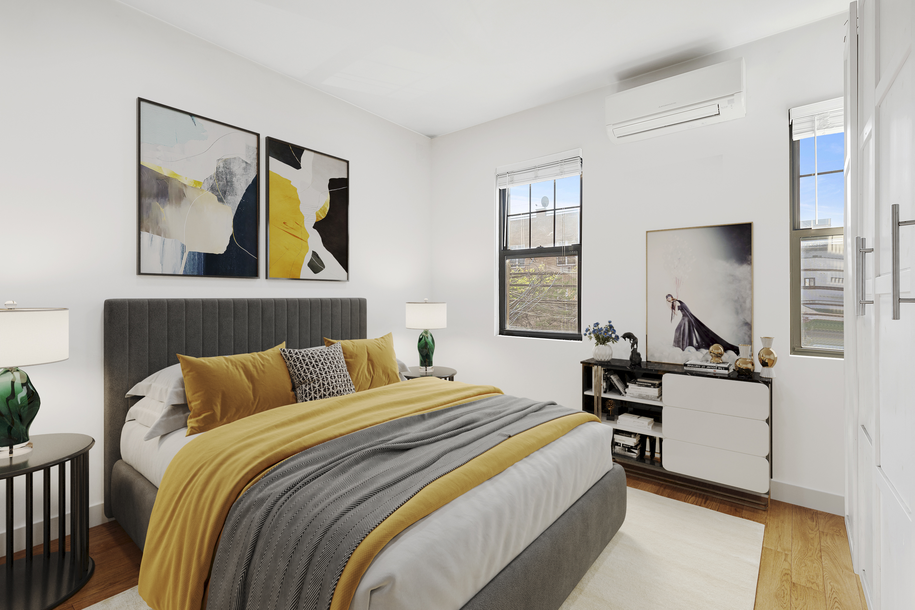 34-57 9th Street Queens, NY 11106 - Photo 5 of 10 a bedroom with a bed and painting on the wall