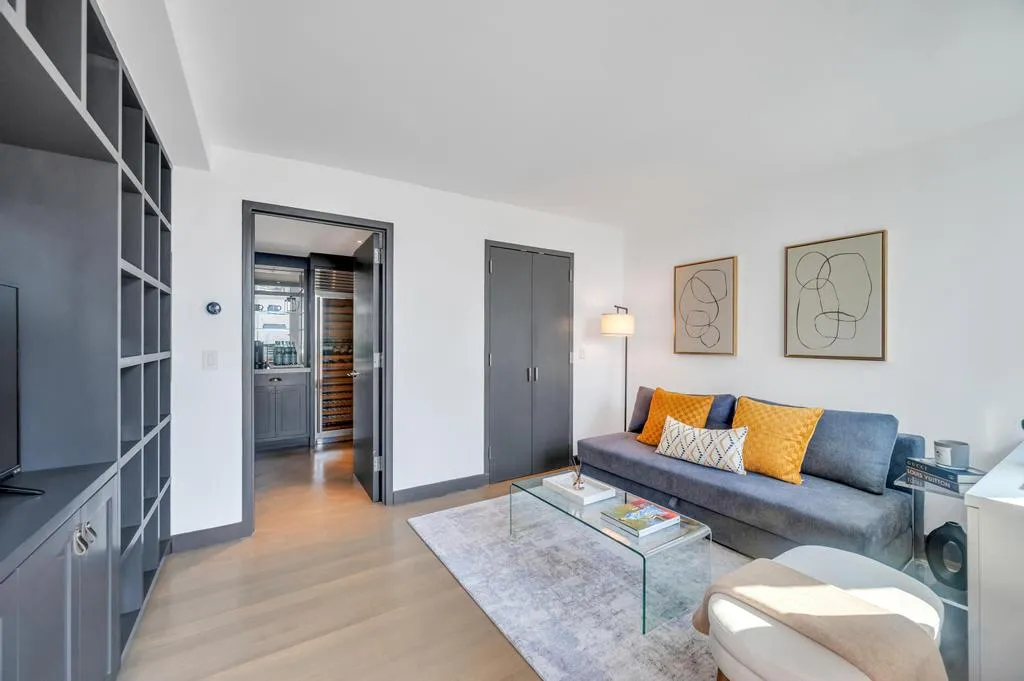 a living room with furniture and a rug