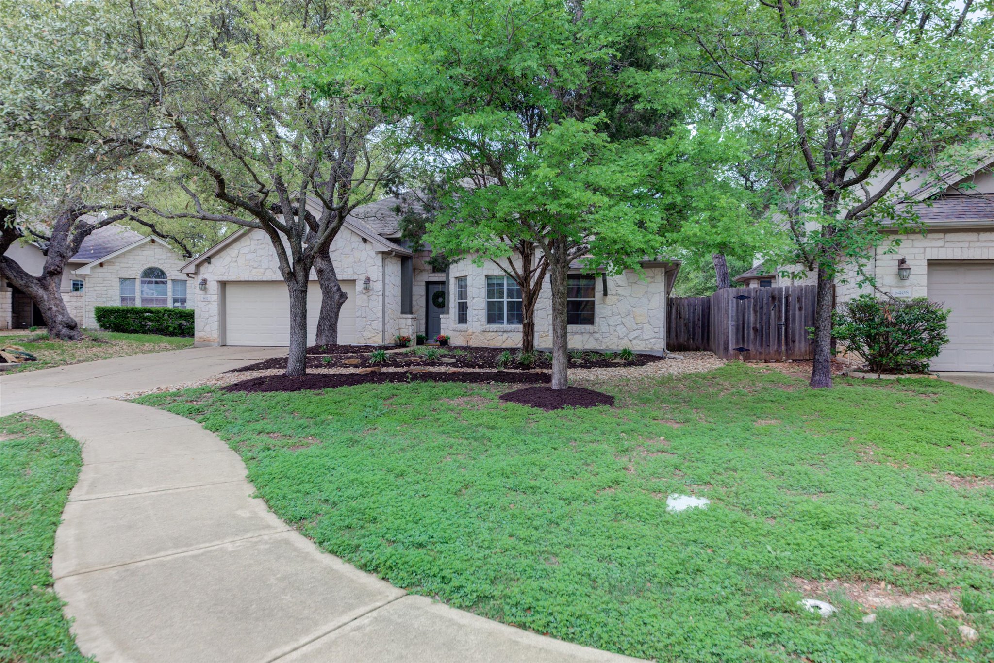 5412 Batak Lane Austin, TX 78749 - Photo 2 of 40 a front view of a house with garden