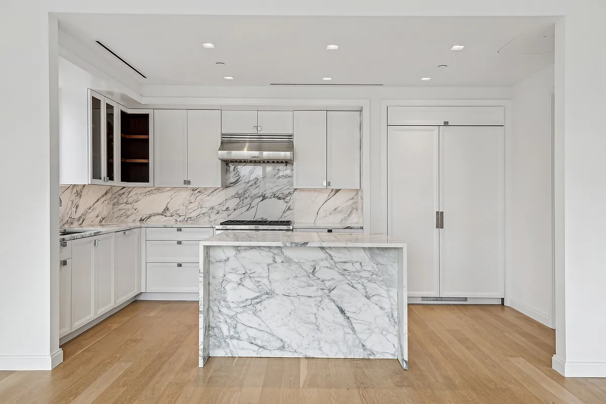 269 West 87th Street, Unit 14A Manhattan, NY 10024 - Photo 4 of 23 a kitchen with white cabinets and sink