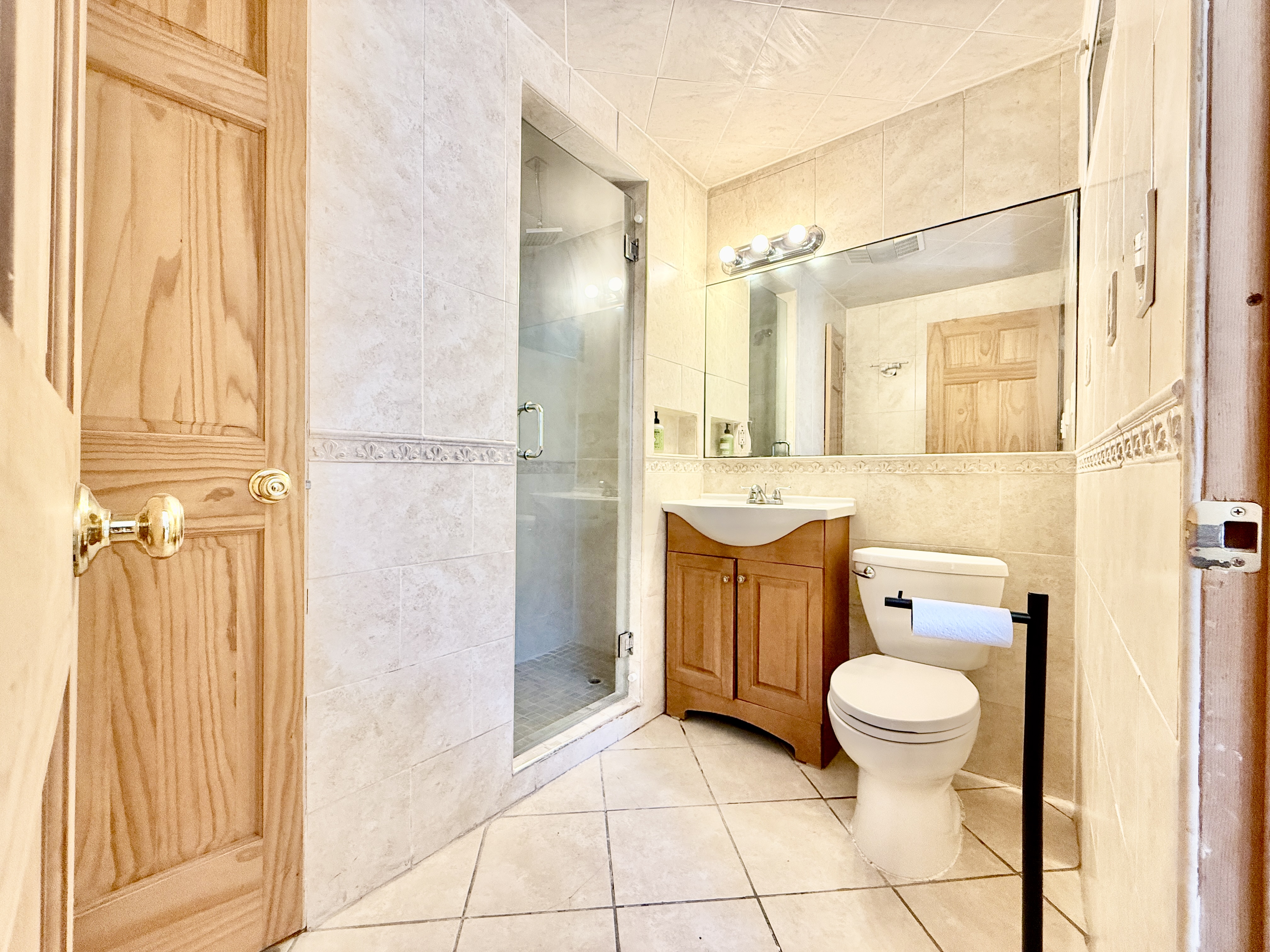 295 Greene Avenue, Unit 2 Brooklyn, NY 11238 - Photo 6 of 6 a bathroom with a toilet a sink and shower