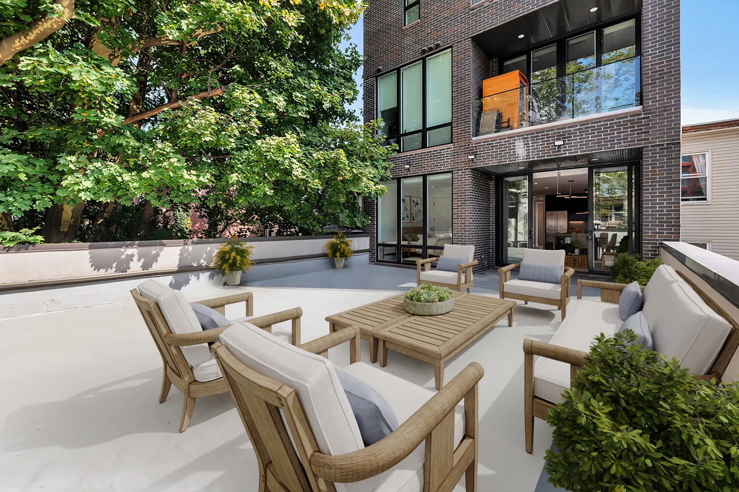 a view of a patio with dining table and chairs and potted plants