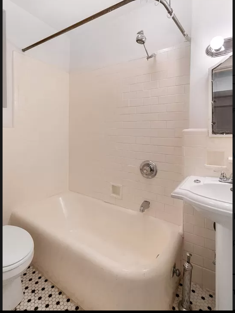 104 Bedford Street, Unit 1C Manhattan, NY 10014 - Photo 8 of 12 a bathroom with a sink a toilet and shower