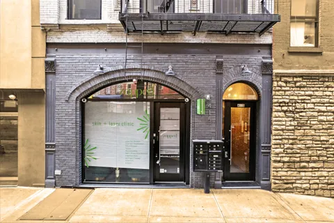 a front view of a building with glass windows