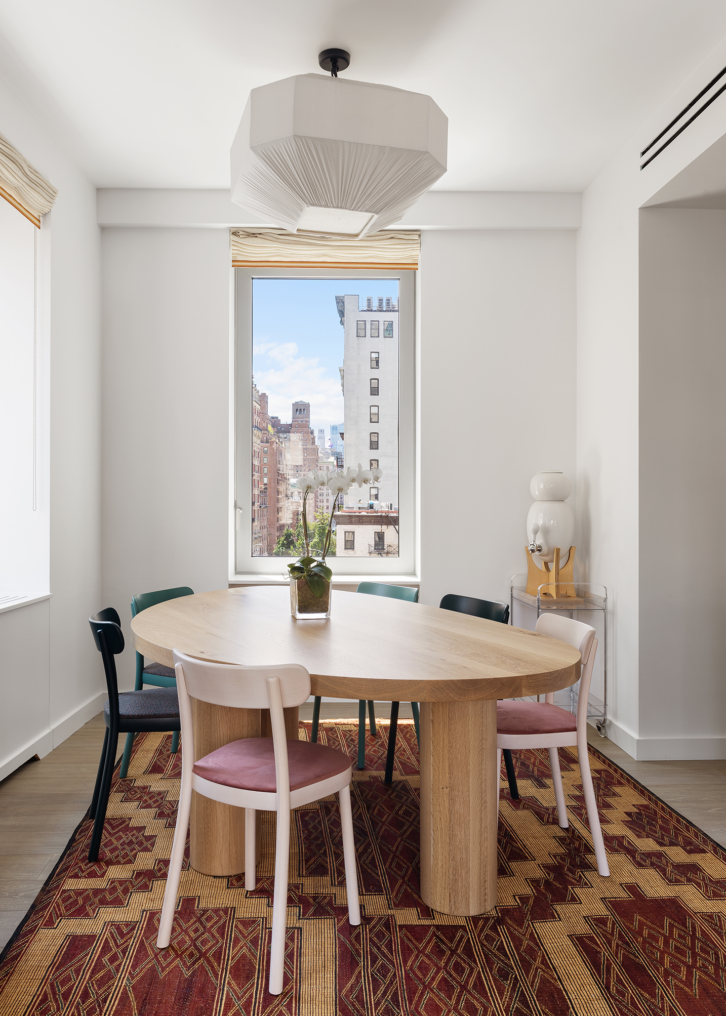 116 University Place, Unit 5 Manhattan, NY 10003 - Photo 9 of 21 a view of a dining room with furniture window and wooden floor