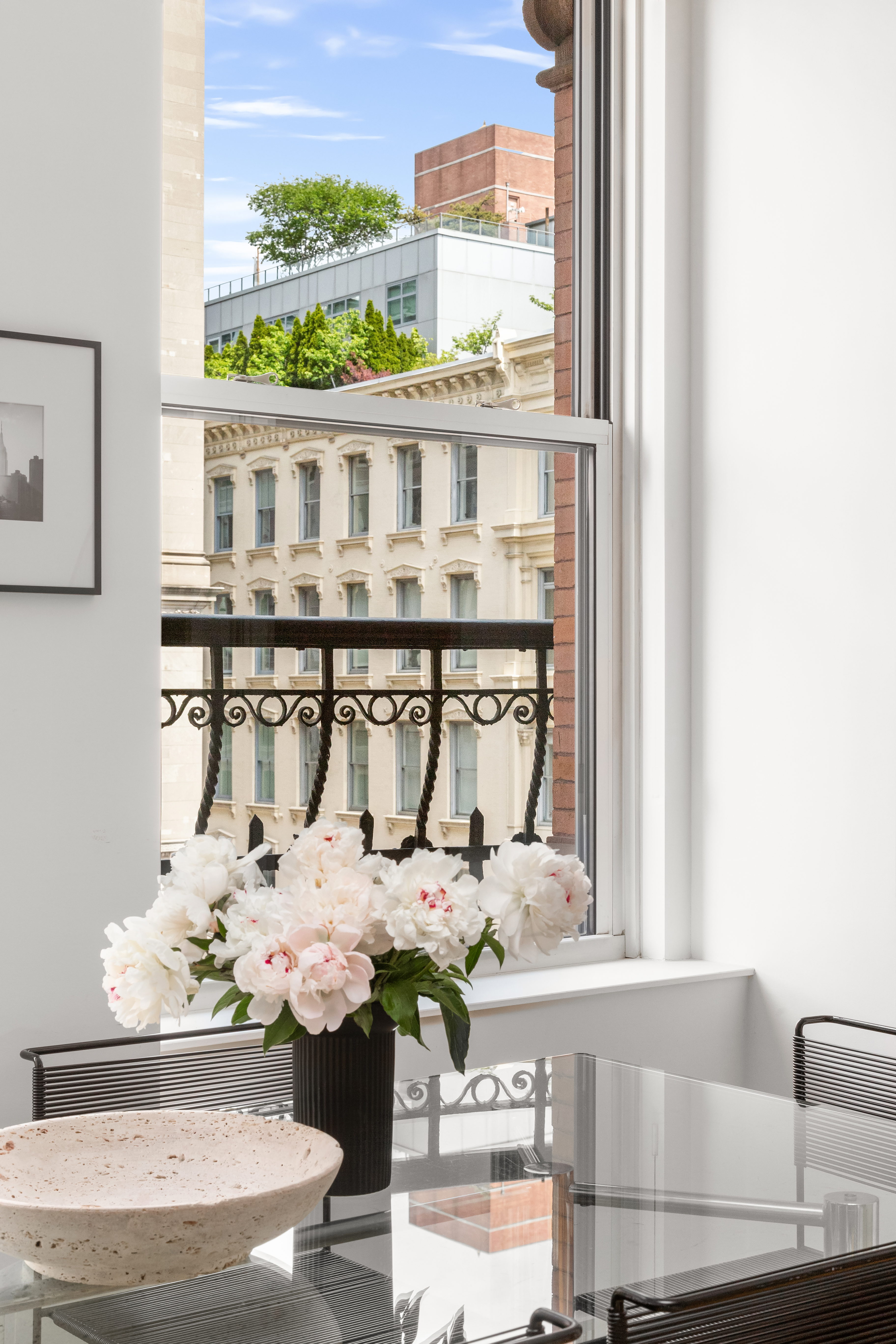 60 West 20th Street, Unit 4E Manhattan, NY 10011 - Photo 5 of 16 a balcony with table and chairs