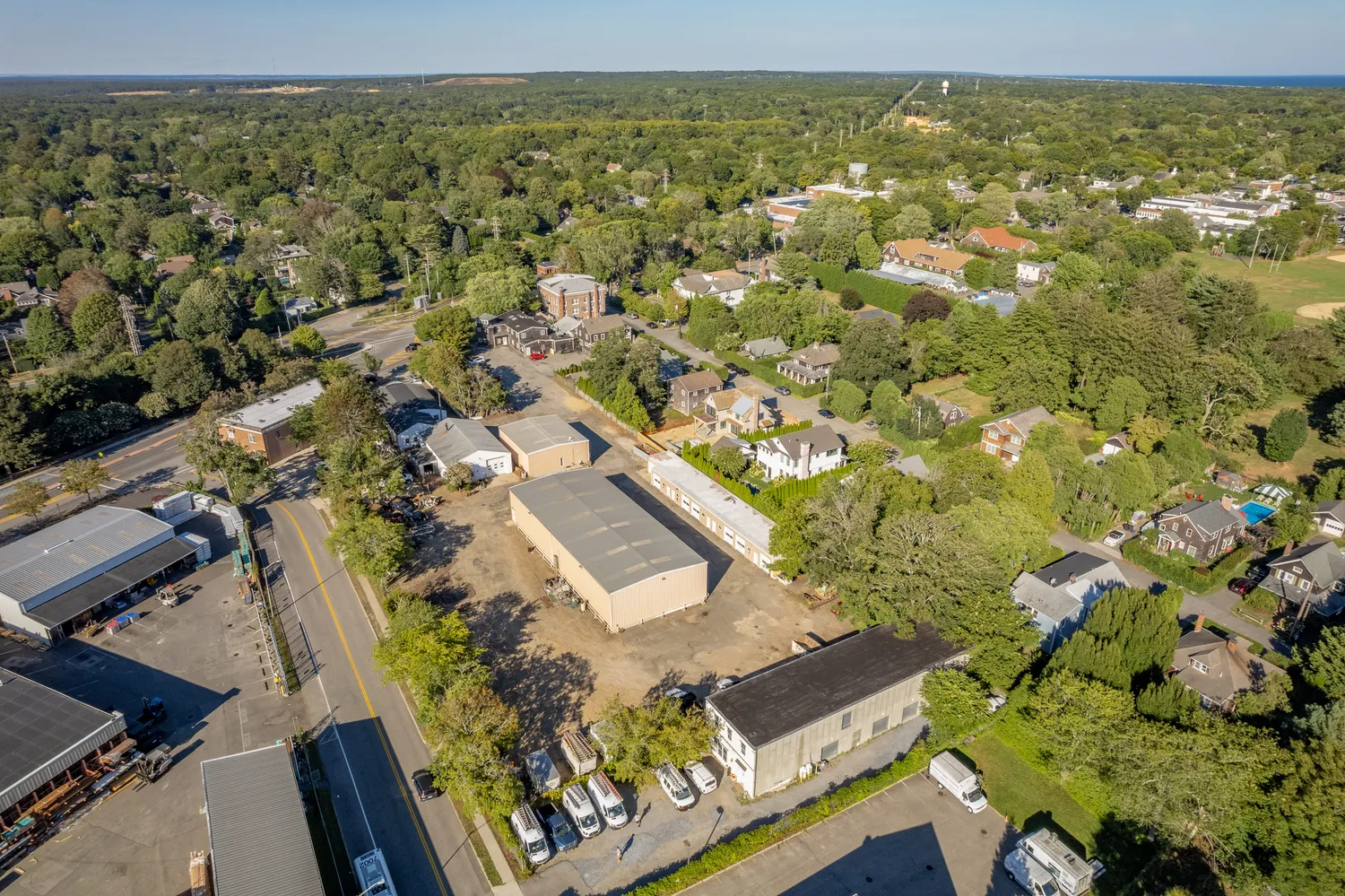 an aerial view of residential houses with outdoor space