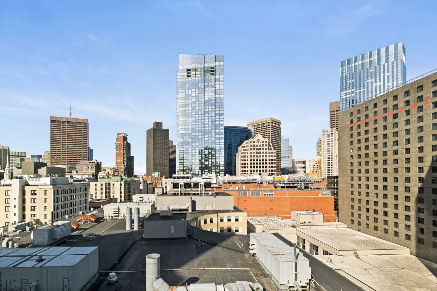 a view of city with tall buildings