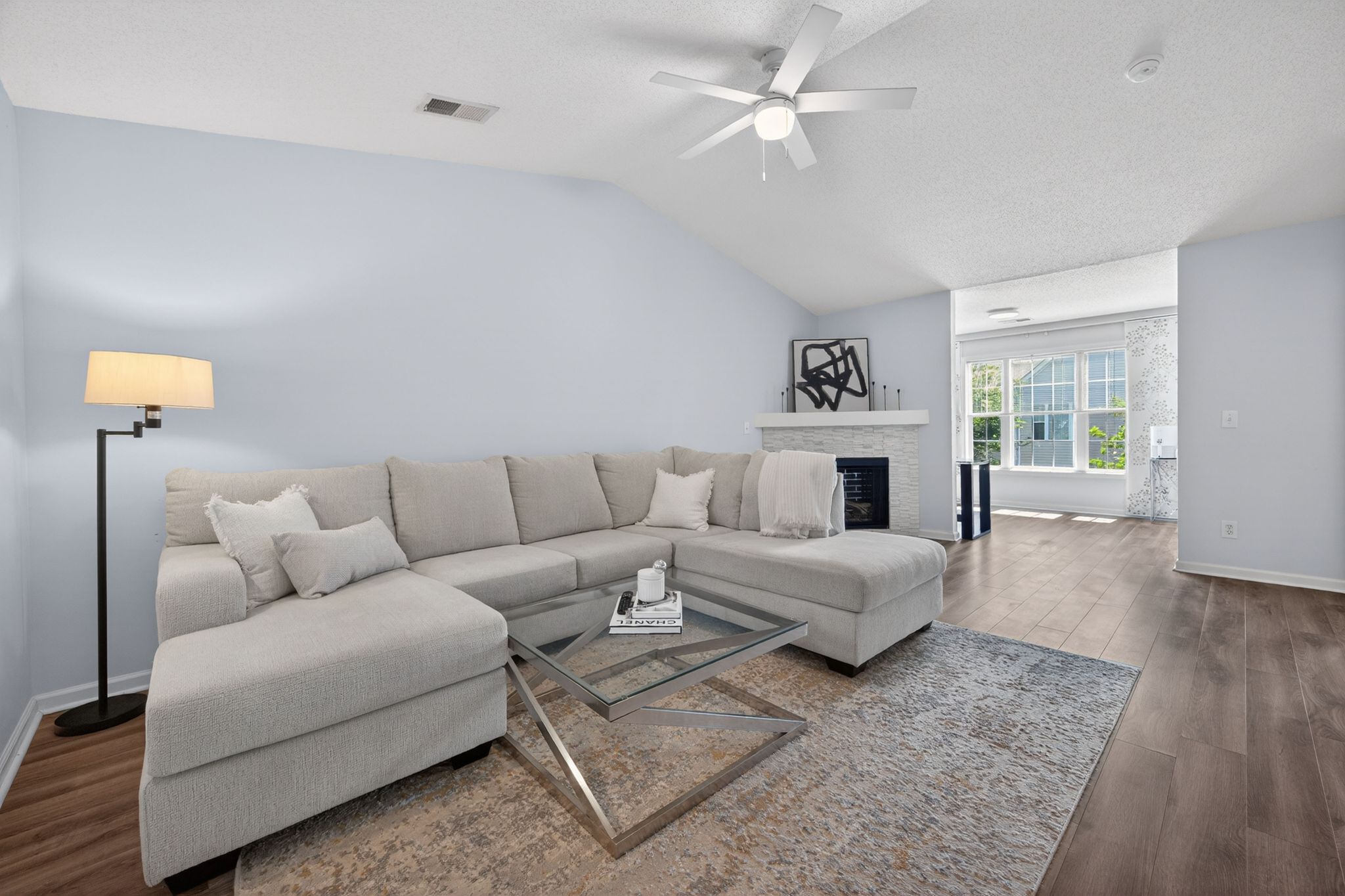 Huntscroft Lane Raleigh, NC 27617 - Photo 21 of 49 a living room with furniture and a chandelier