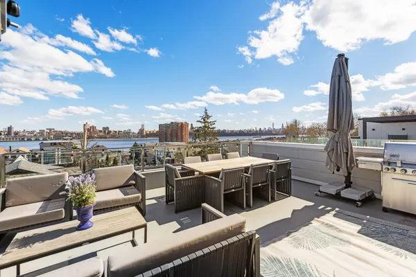 a view of a terrace with furniture