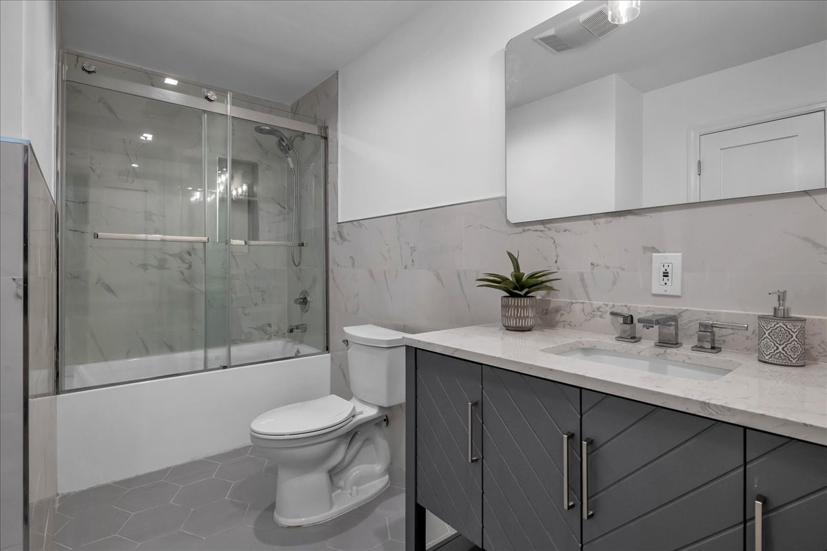 448 Halsey Street, Unit 1 Brooklyn, NY 11233 - Photo 17 of 22 a bathroom with a sink a toilet and shower