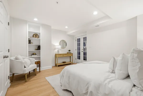 a spacious bedroom with a bed and a table
