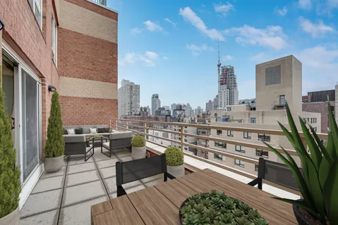 a view of a terrace with seating area