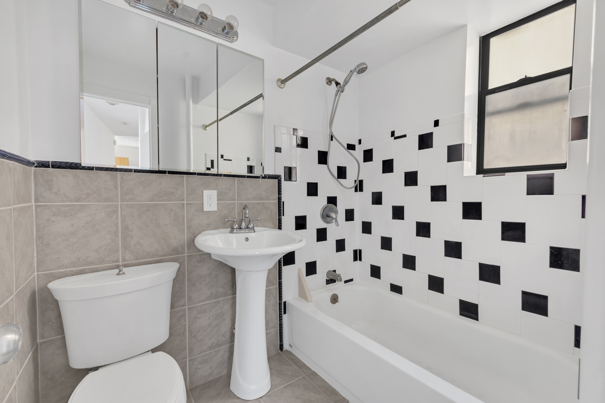 7609 4th Avenue, Unit B1 Brooklyn, NY 11209 - Photo 9 of 17 a bathroom with a sink toilet and shower