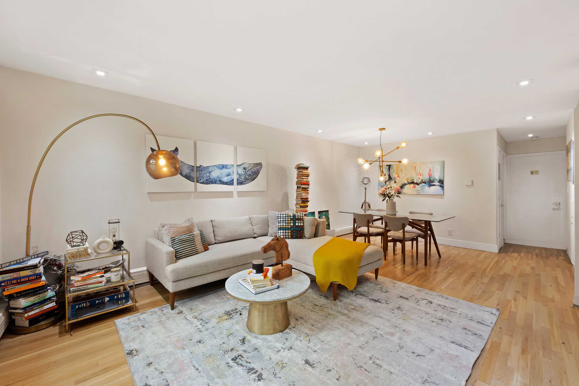 138 North 3rd Street, Unit 1 Brooklyn, NY 11249 - Photo 2 of 8 a living room with furniture and wooden floor