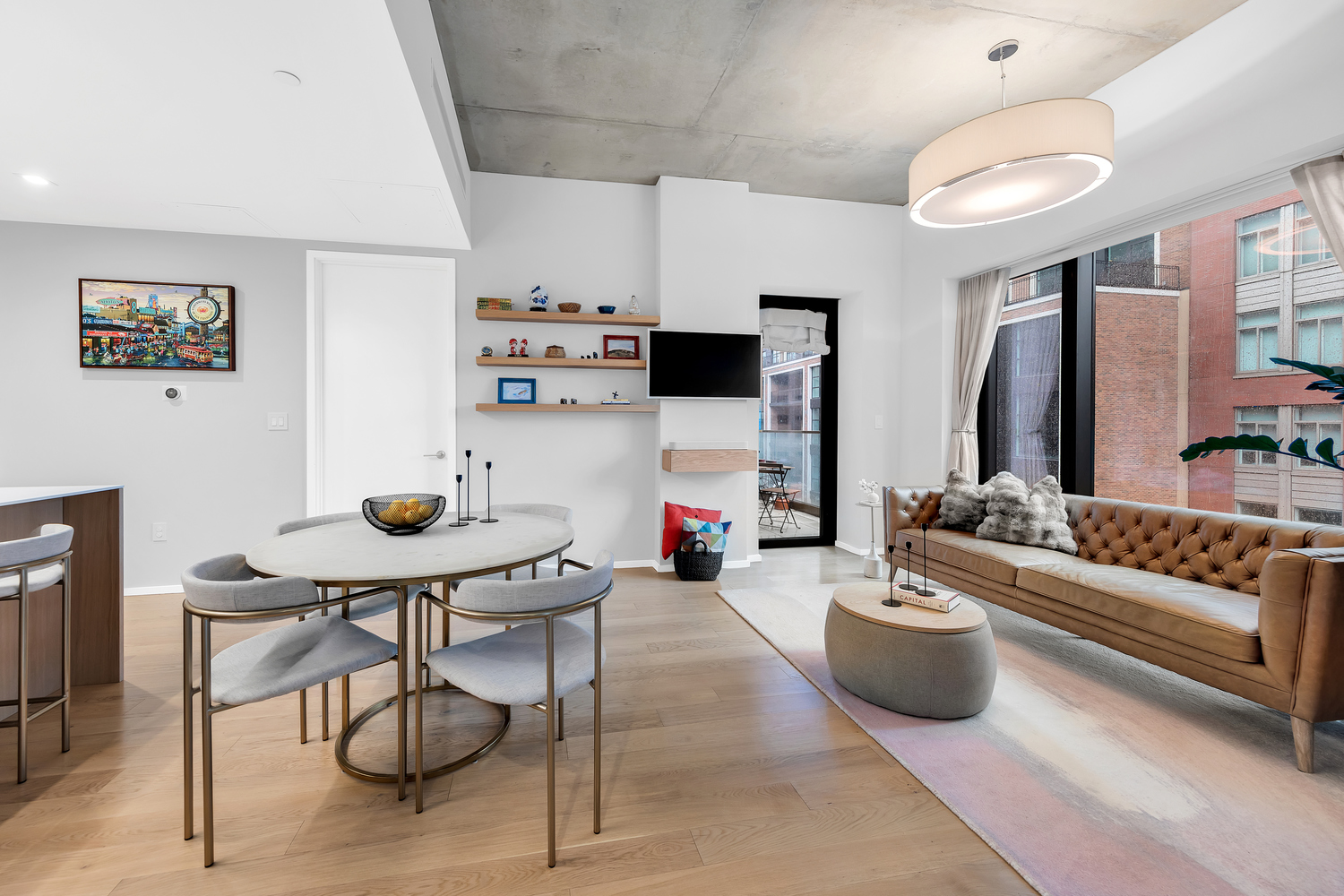 98 Front Street, Unit 8J Brooklyn, NY 11201 - Photo 3 of 18 a living room with furniture and a flat screen tv