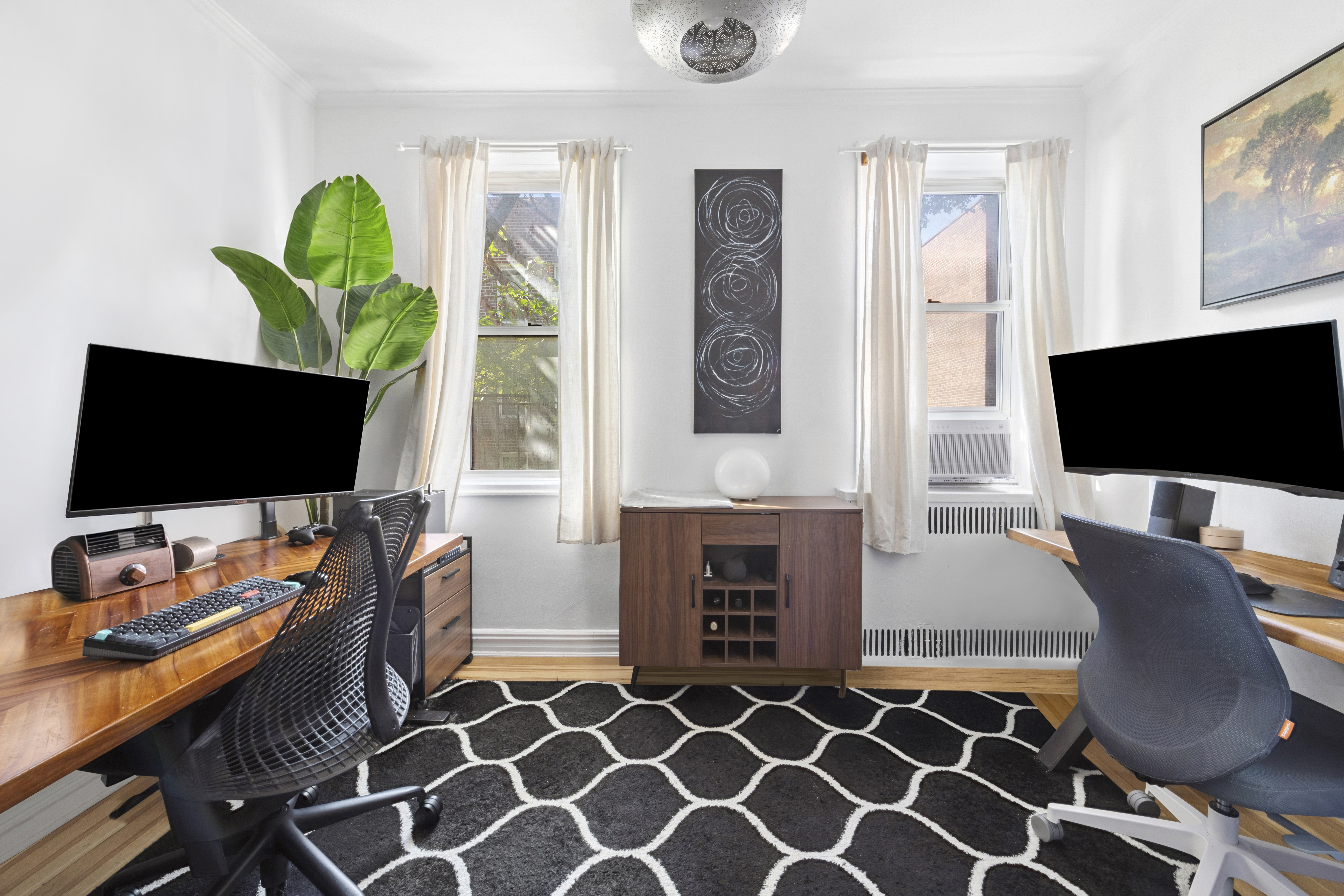 140 East 2nd Street, Unit 5F Brooklyn, NY 11218 - Photo 5 of 7 a view of a livingroom with furniture and a flat screen tv