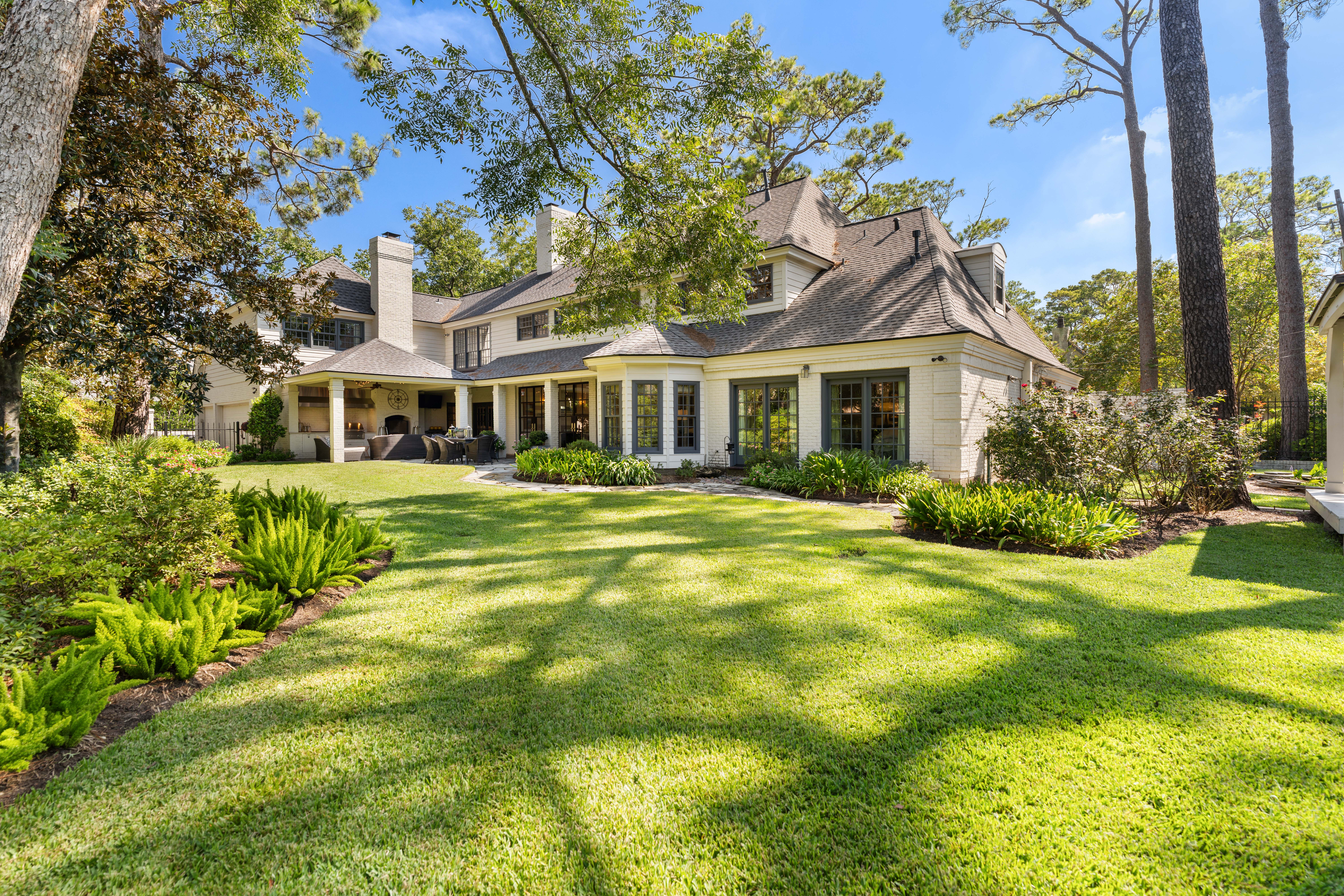 711 Pifer Road Houston, TX 77024 - Photo 48 of 53 a front view of a house with a garden