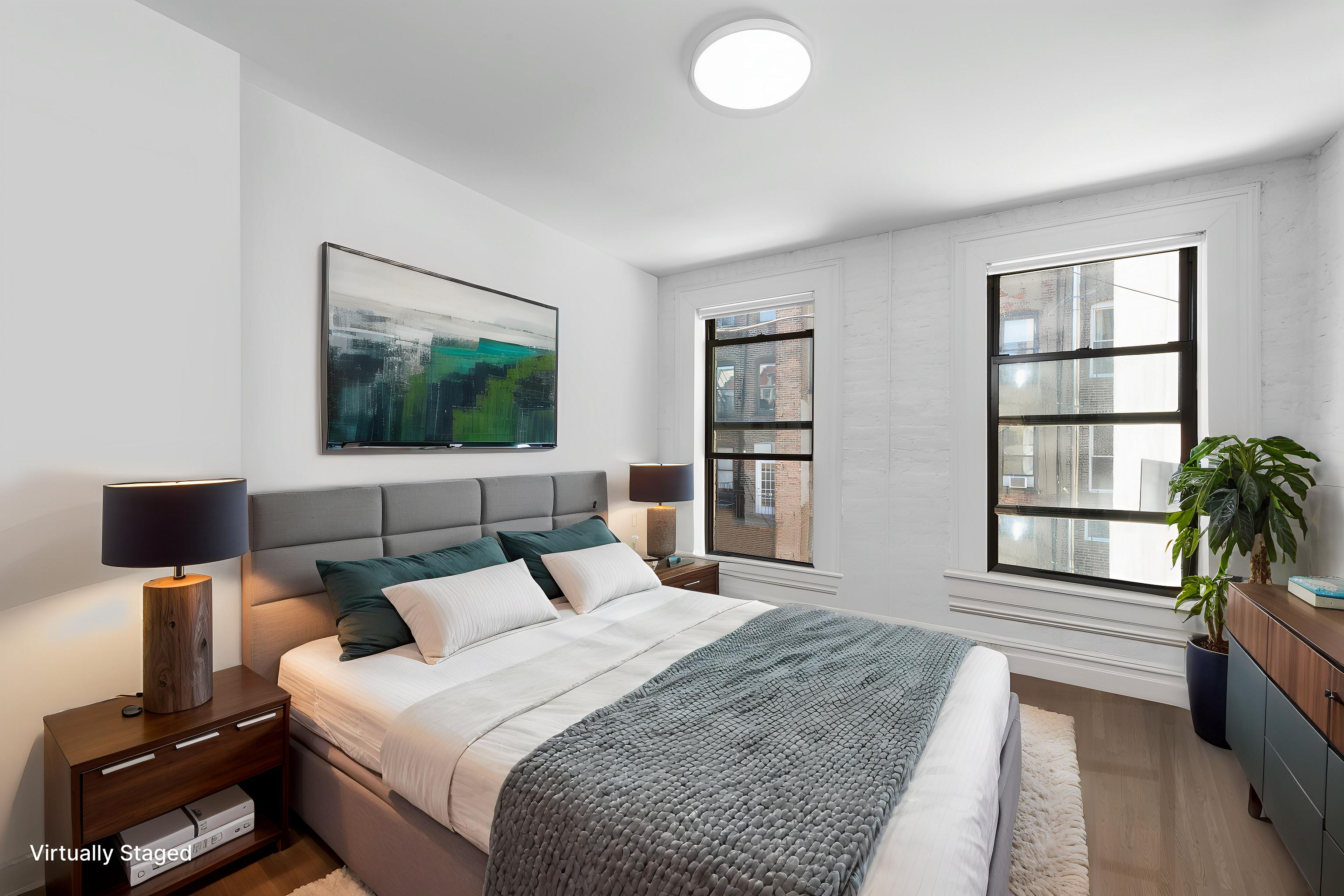 112 East 4th Street, Unit 4 Manhattan, NY 10003 - Photo 4 of 6 a bedroom with a bed and wooden floor