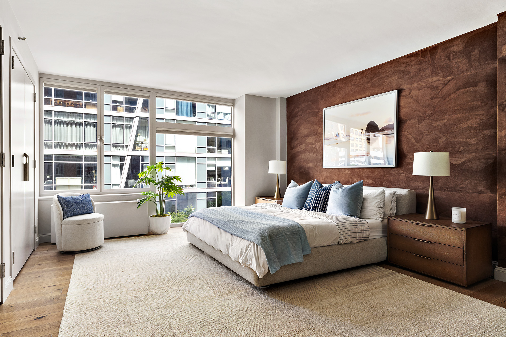 151 West 17th Street, Unit 4G Manhattan, NY 10011 - Photo 9 of 14 a bedroom with a bed couch and a large window