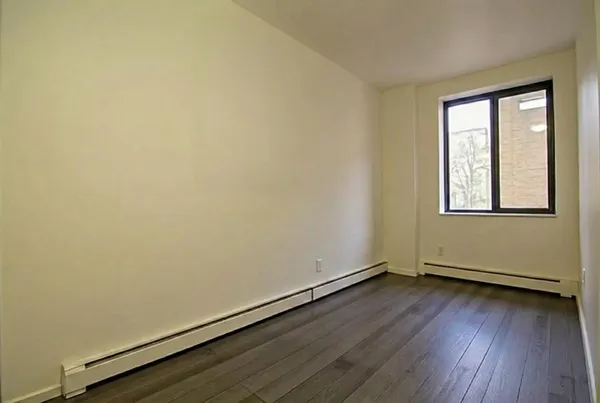 a bedroom with a bed and a table in it