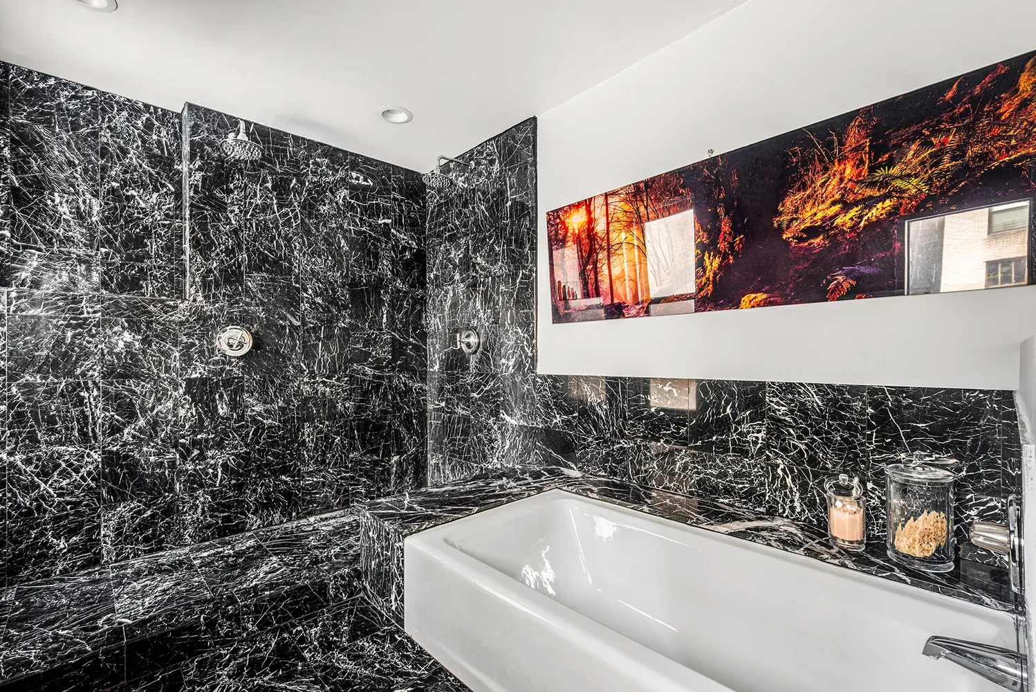 a bathroom with a bathtub and shower