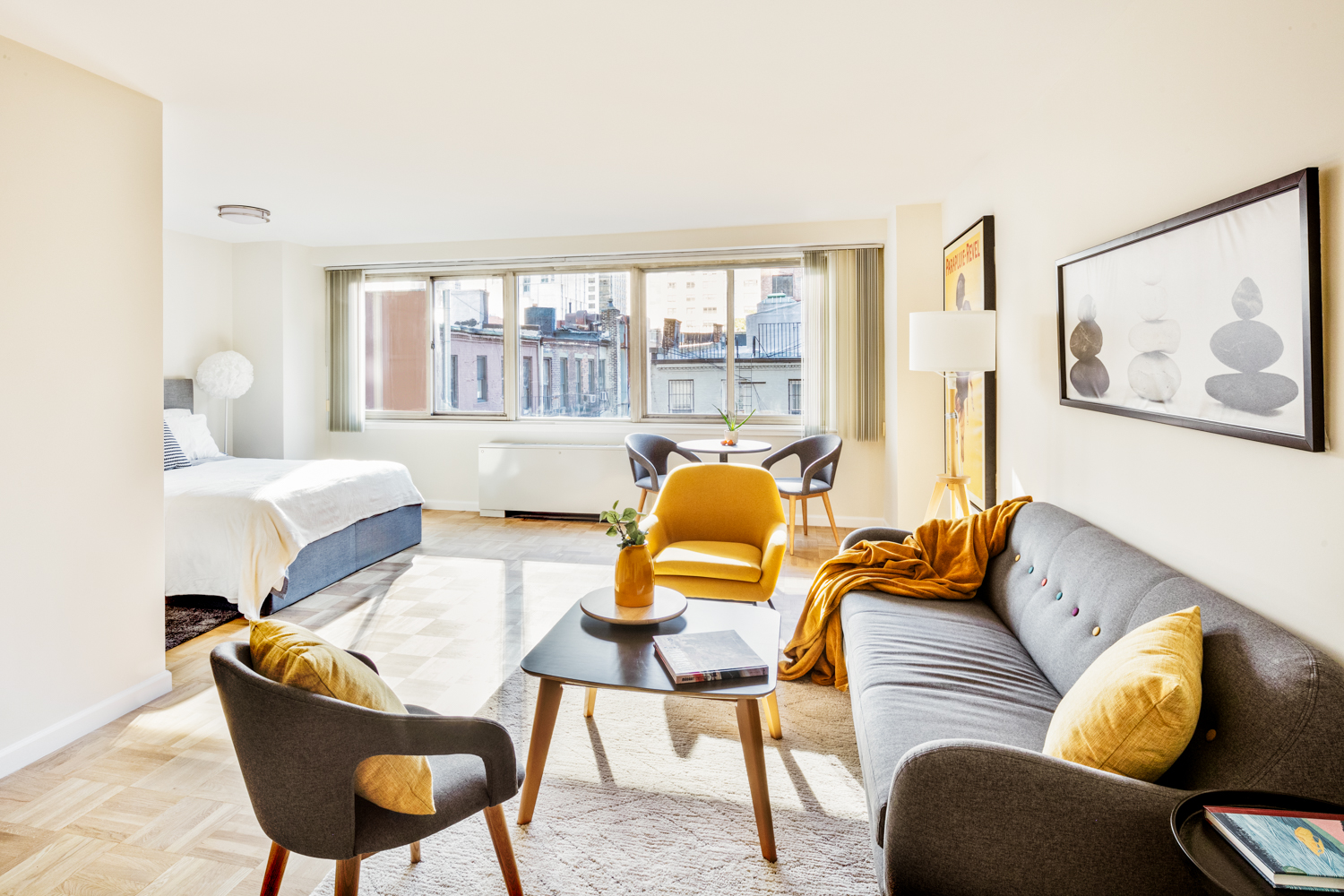 401 East 86th Street, Unit 5M Manhattan, NY 10028 - Photo 1 of 8 a living room with furniture and a large window
