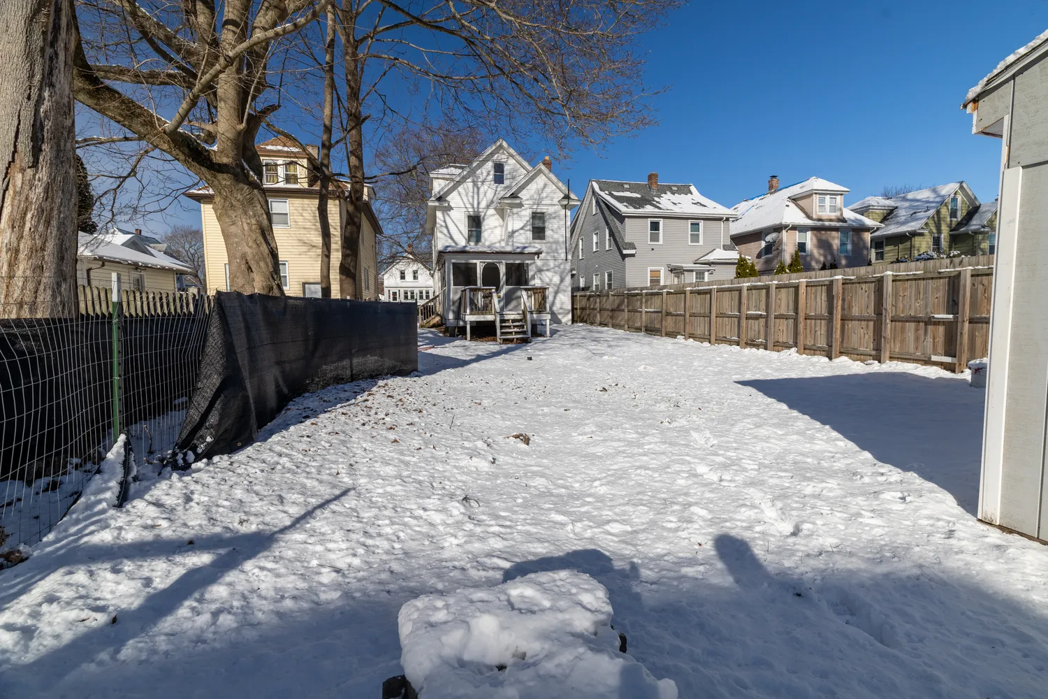 a view of a house with a snow in the yard