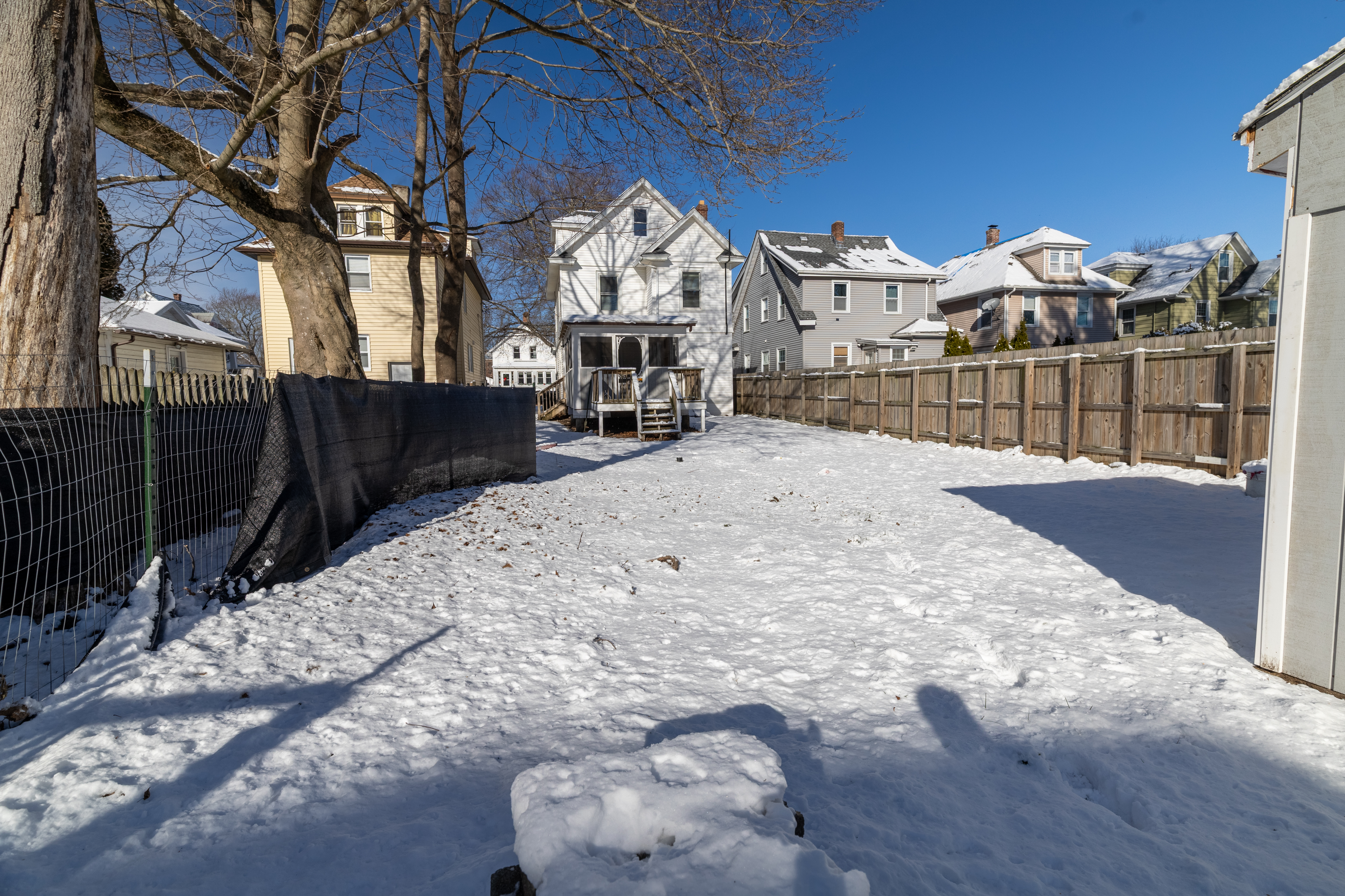 90 School Street New London, CT 06320 - Photo 27 of 34 a view of a house with a snow in the yard