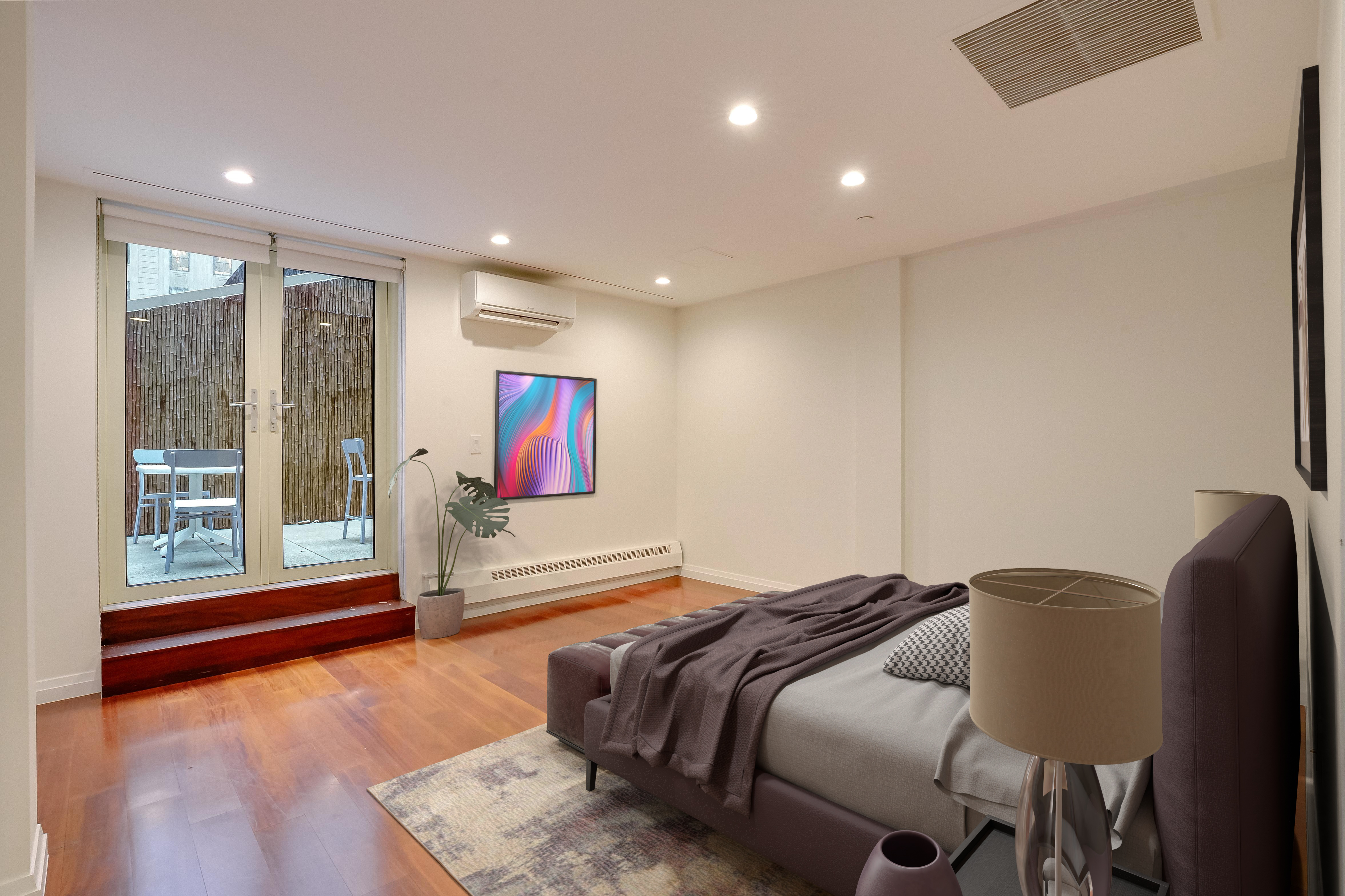 55 Wall Street, Unit PH910 Manhattan, NY 10005 - Photo 13 of 19 a spacious bedroom with a bed and glass door