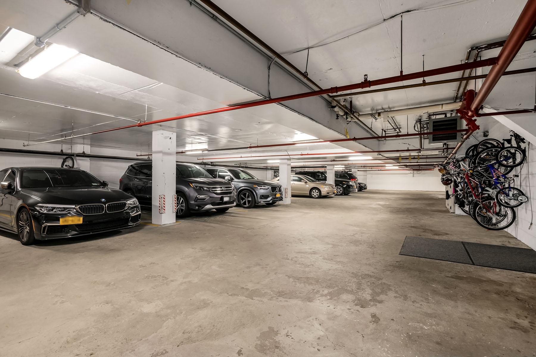 5-19 Borden Avenue, Unit 6C Queens, NY 11101 - Photo 10 of 11 a view of parking garage with cars