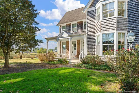 a view of house with yard