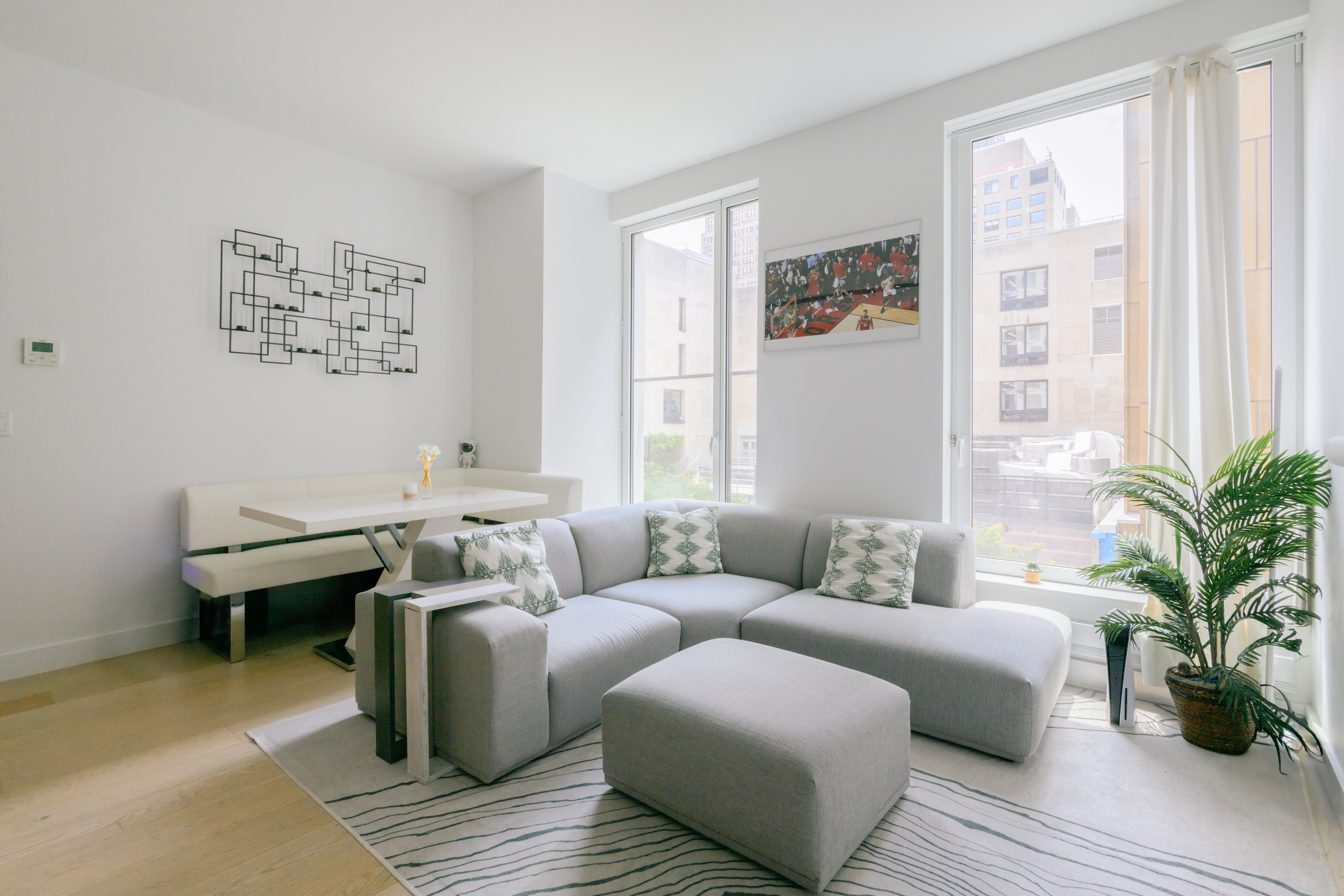 a living room with furniture and next to a window