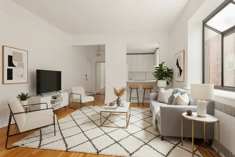 a living room with furniture a flat screen tv and a table