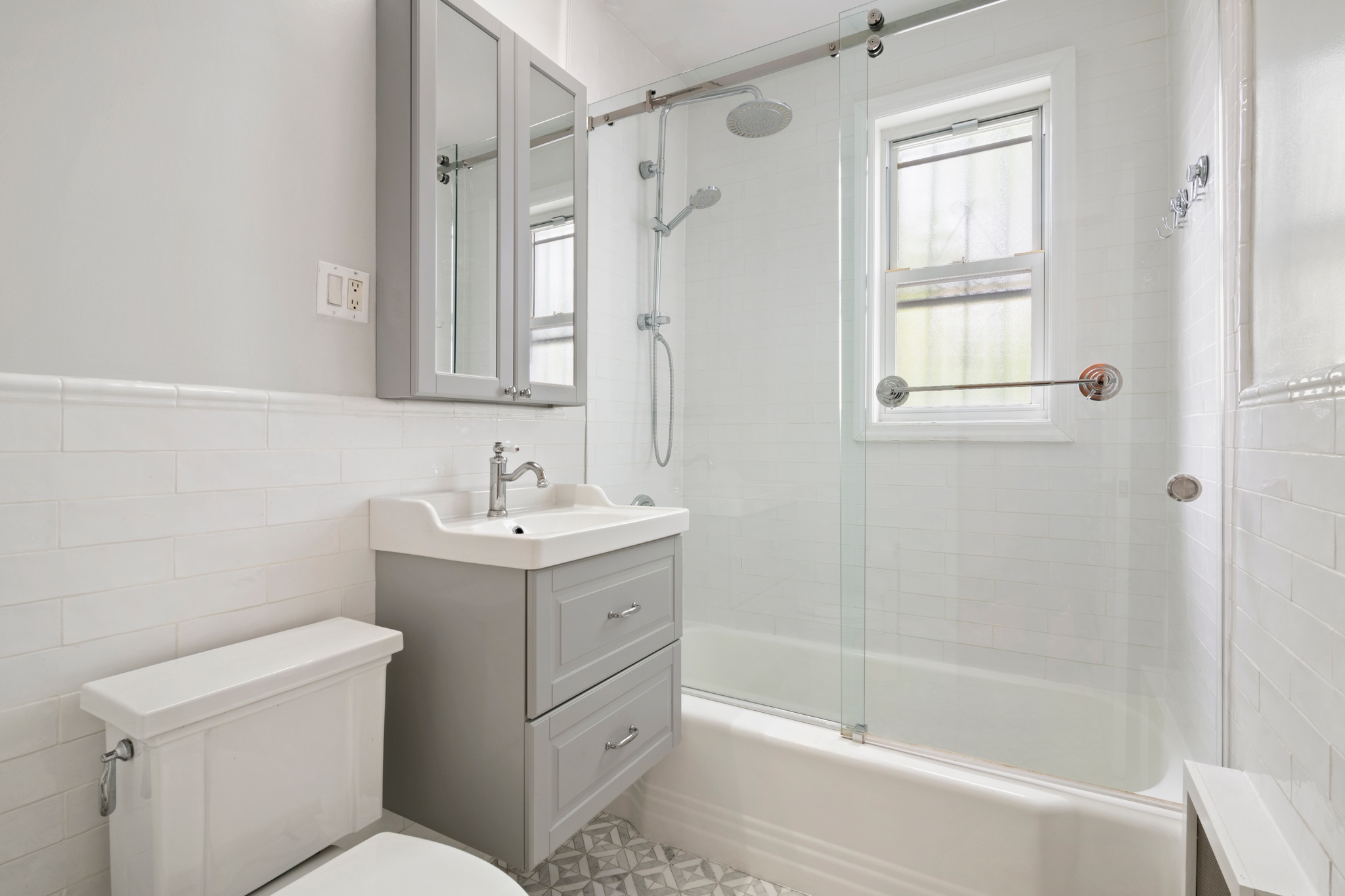 95 Chester Avenue, Unit 1 Brooklyn, NY 11218 - Photo 12 of 13 a bathroom with a sink toilet and shower