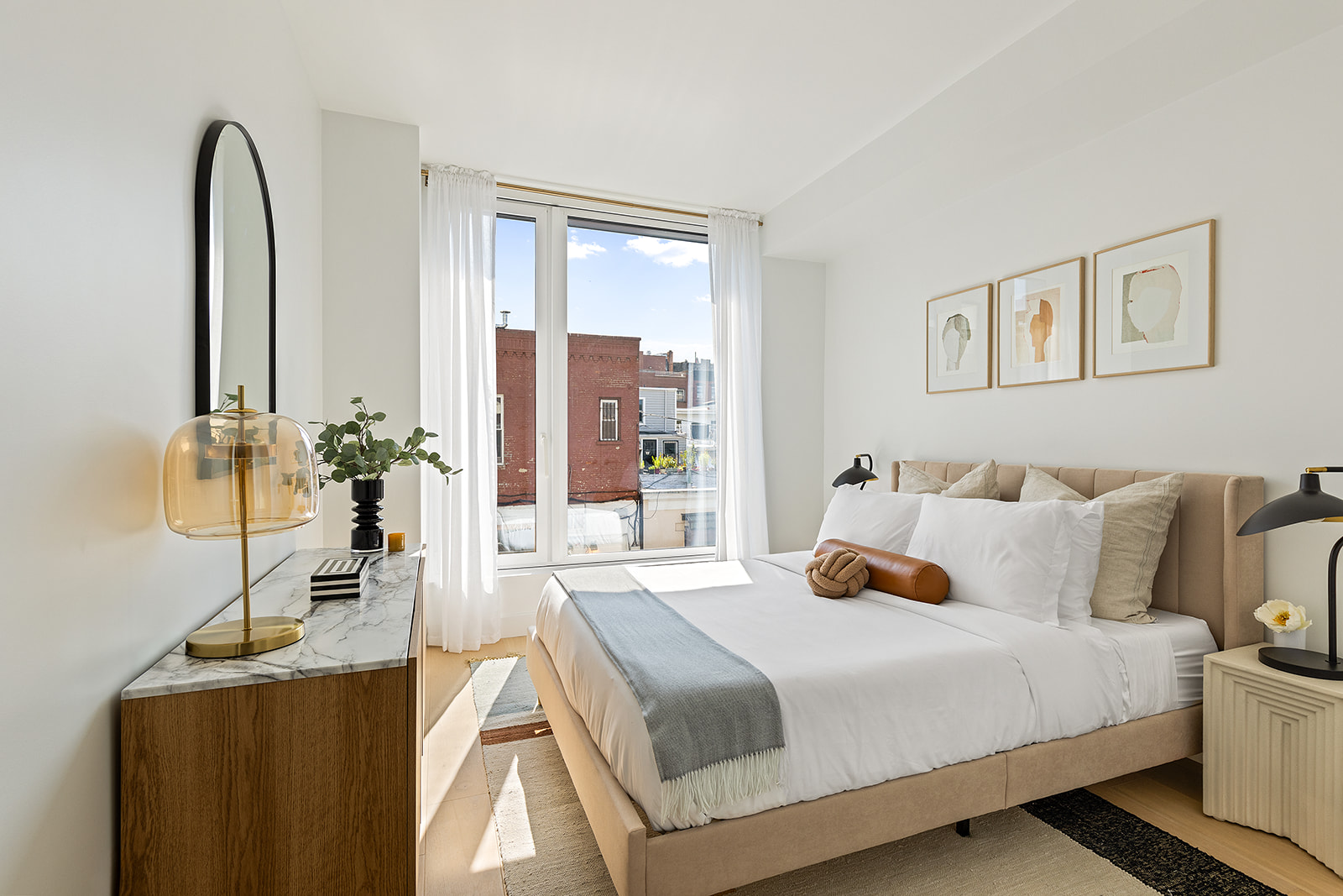 171 North 1st Street, Unit 3K Brooklyn, NY 11211 - Photo 4 of 13 a bedroom with a bed and a night stand