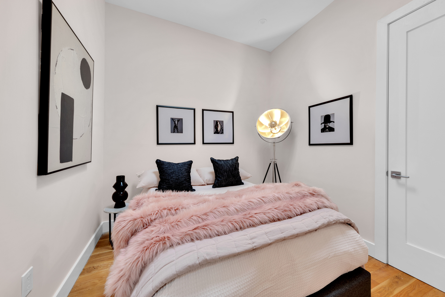 1118 Decatur Street Brooklyn, NY 11207 - Photo 12 of 18 a bedroom with a bed and painting on the wall