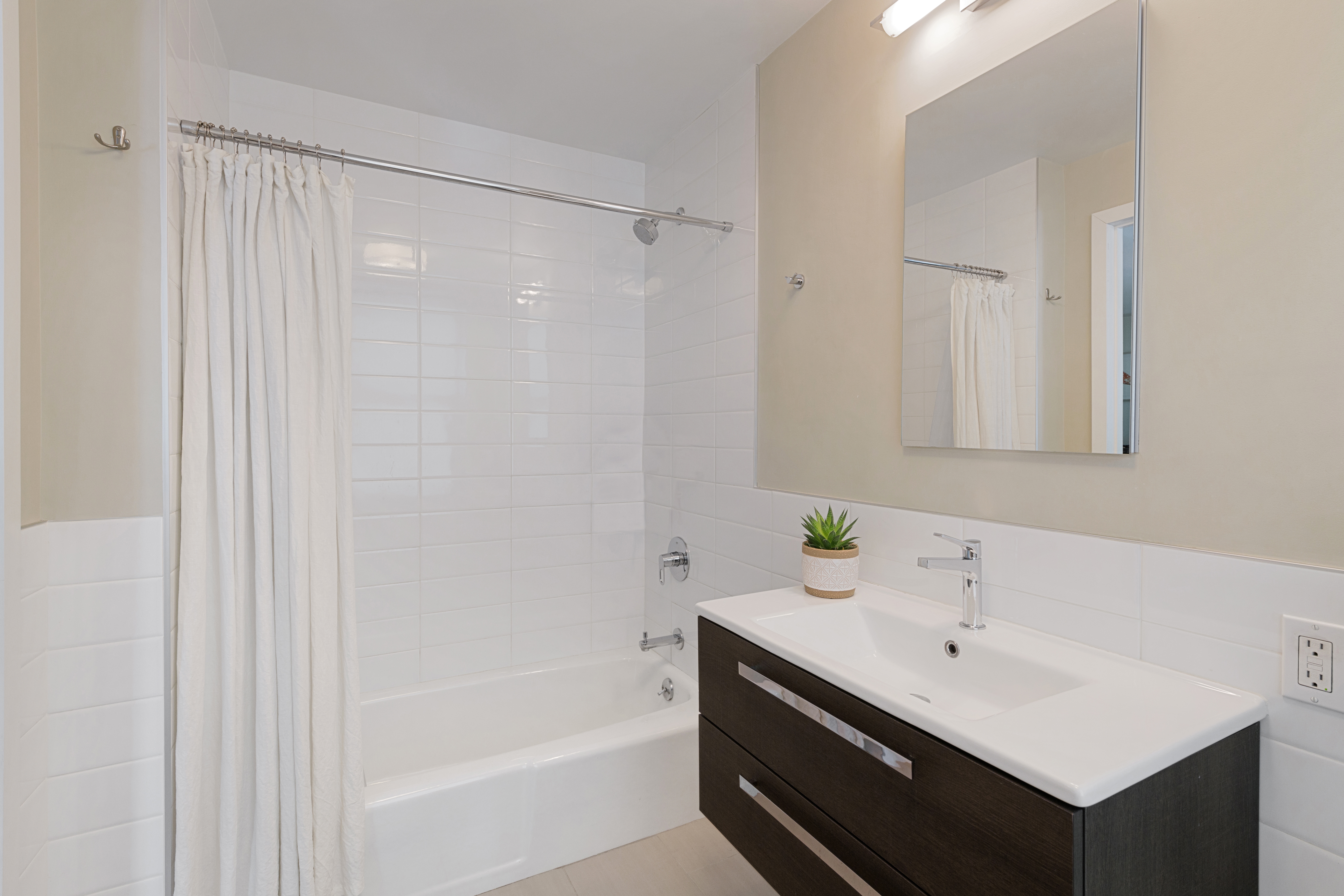 24 Greenwich Avenue, Unit 2 Manhattan, NY 10011 - Photo 5 of 6 a bathroom with a sink and a bathtub