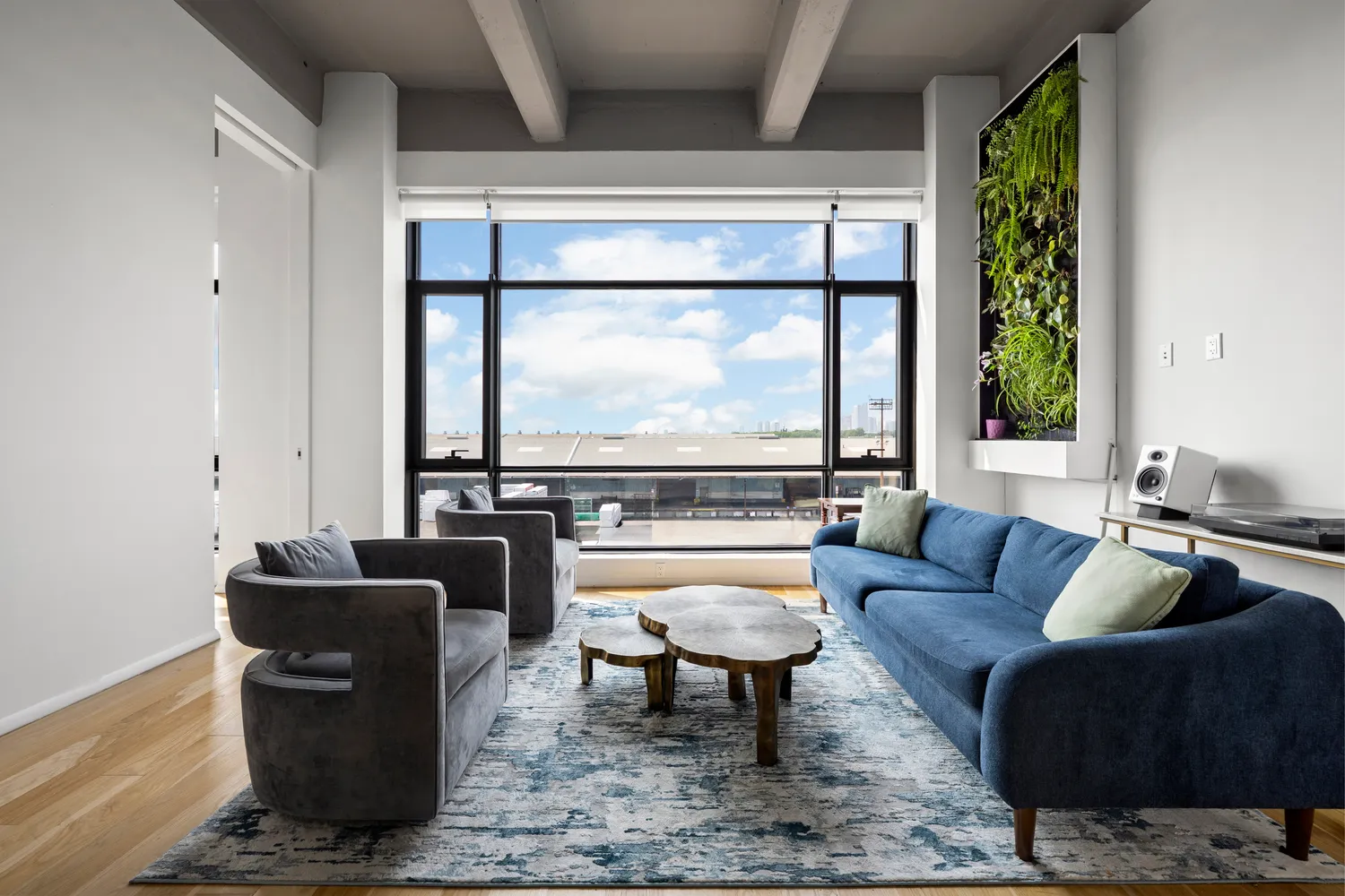 a living room with furniture and a window