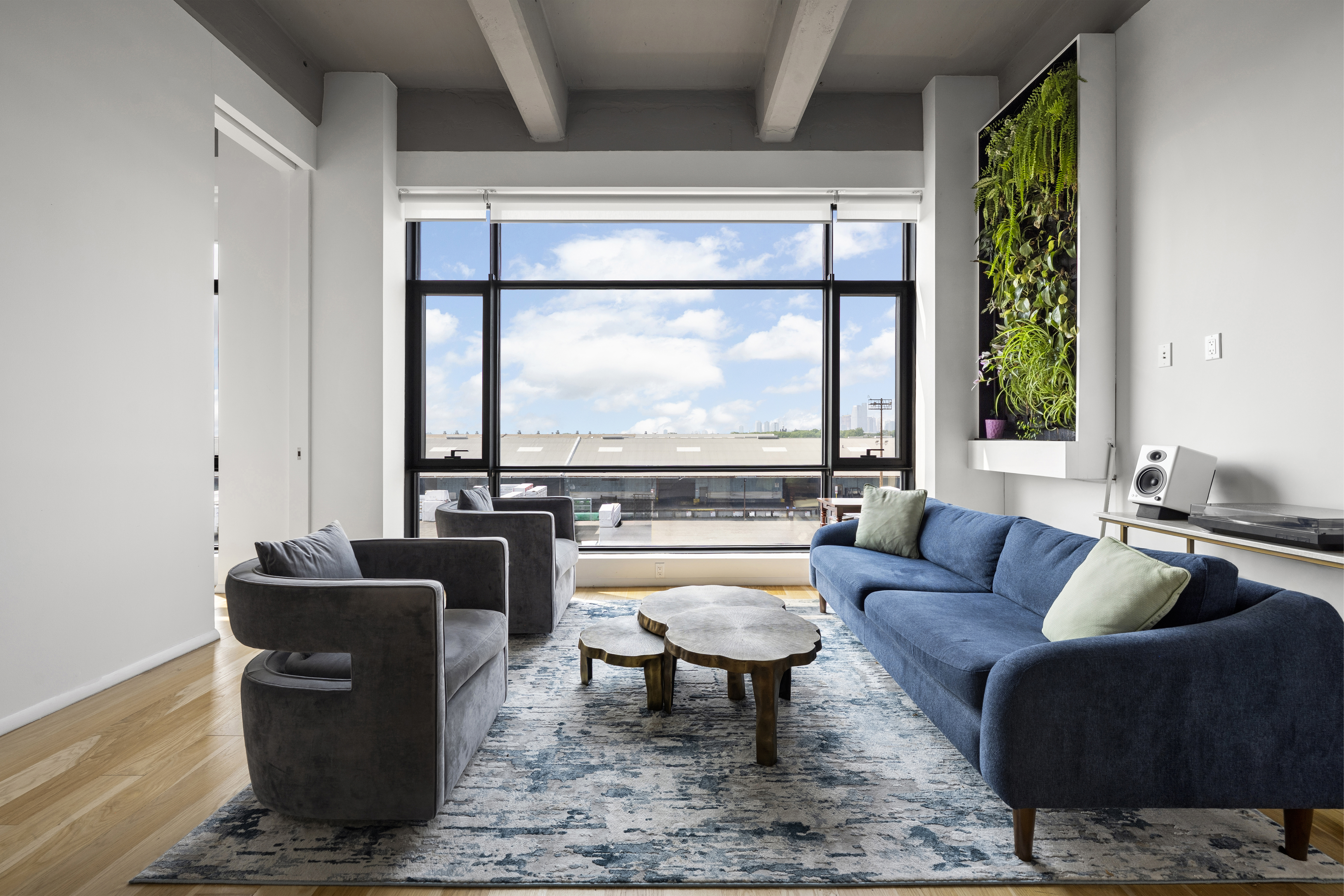 a living room with furniture and a window
