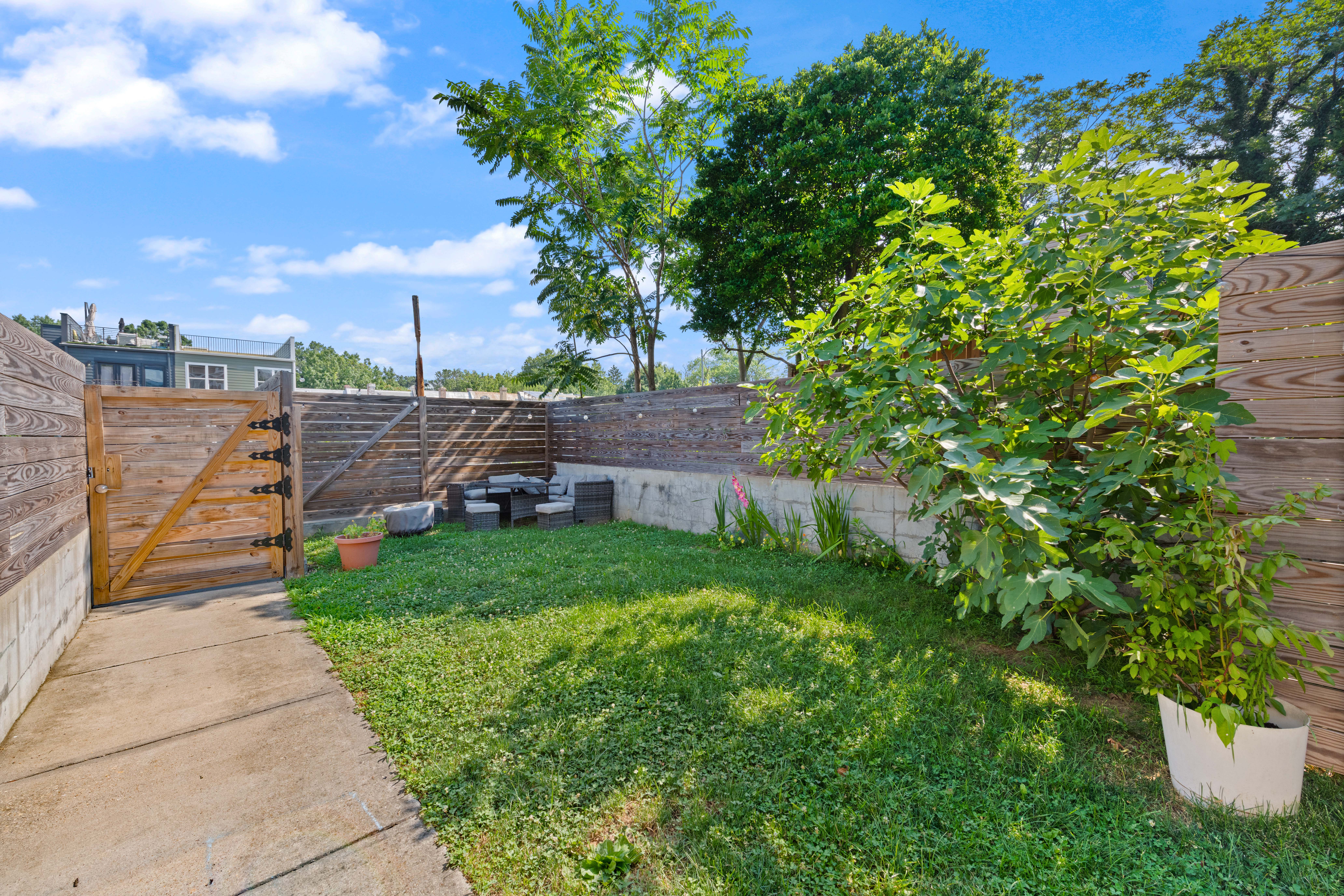 319 Varnum Street Northwest, Unit 3 Washington, DC 20011 - Photo 28 of 29 a front view of a house with a yard