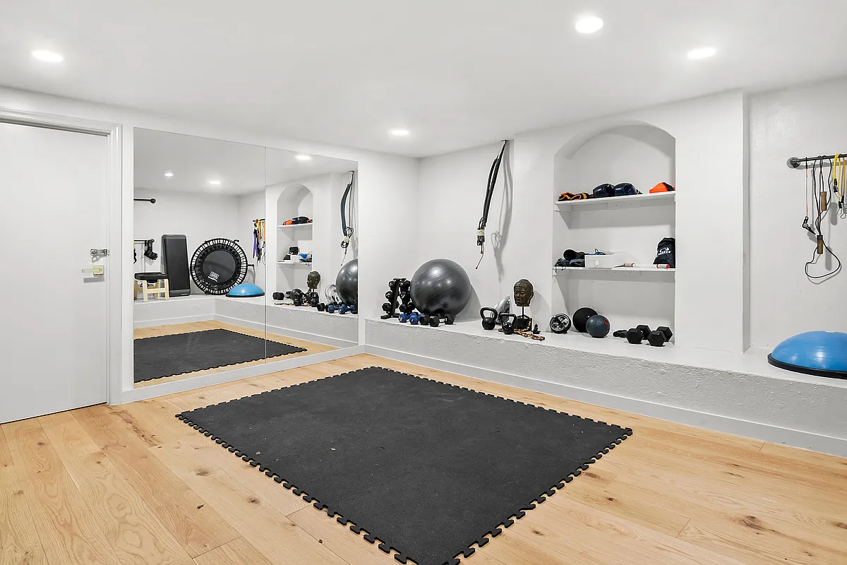 87 Monroe Street, Unit 1 Brooklyn, NY 11216 - Photo 8 of 11 a view of a room with gym equipment