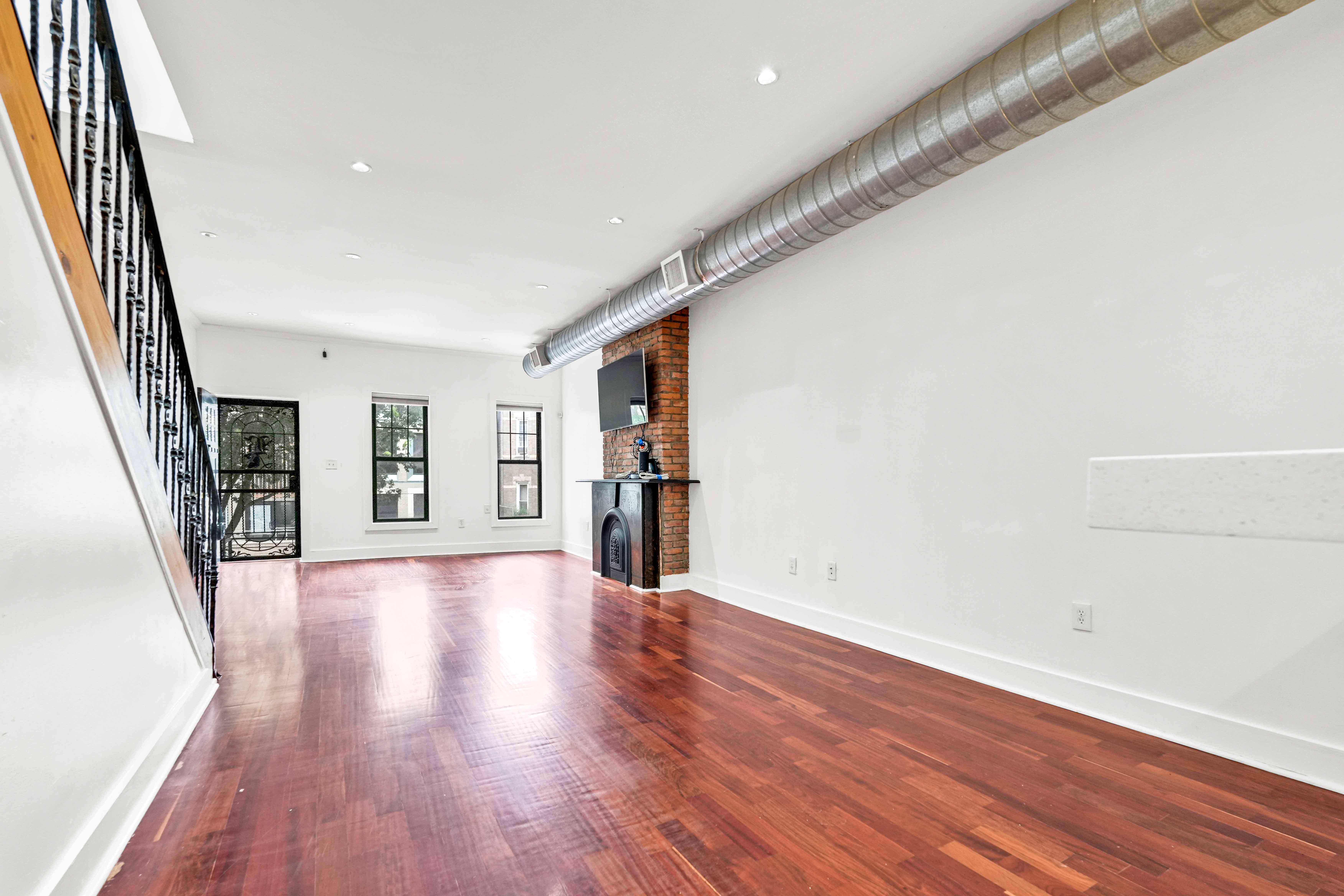 17 A Suydam Place, Unit 2 Brooklyn, NY 11233 - Photo 10 of 28 a view of an empty room with wooden floor and stairs