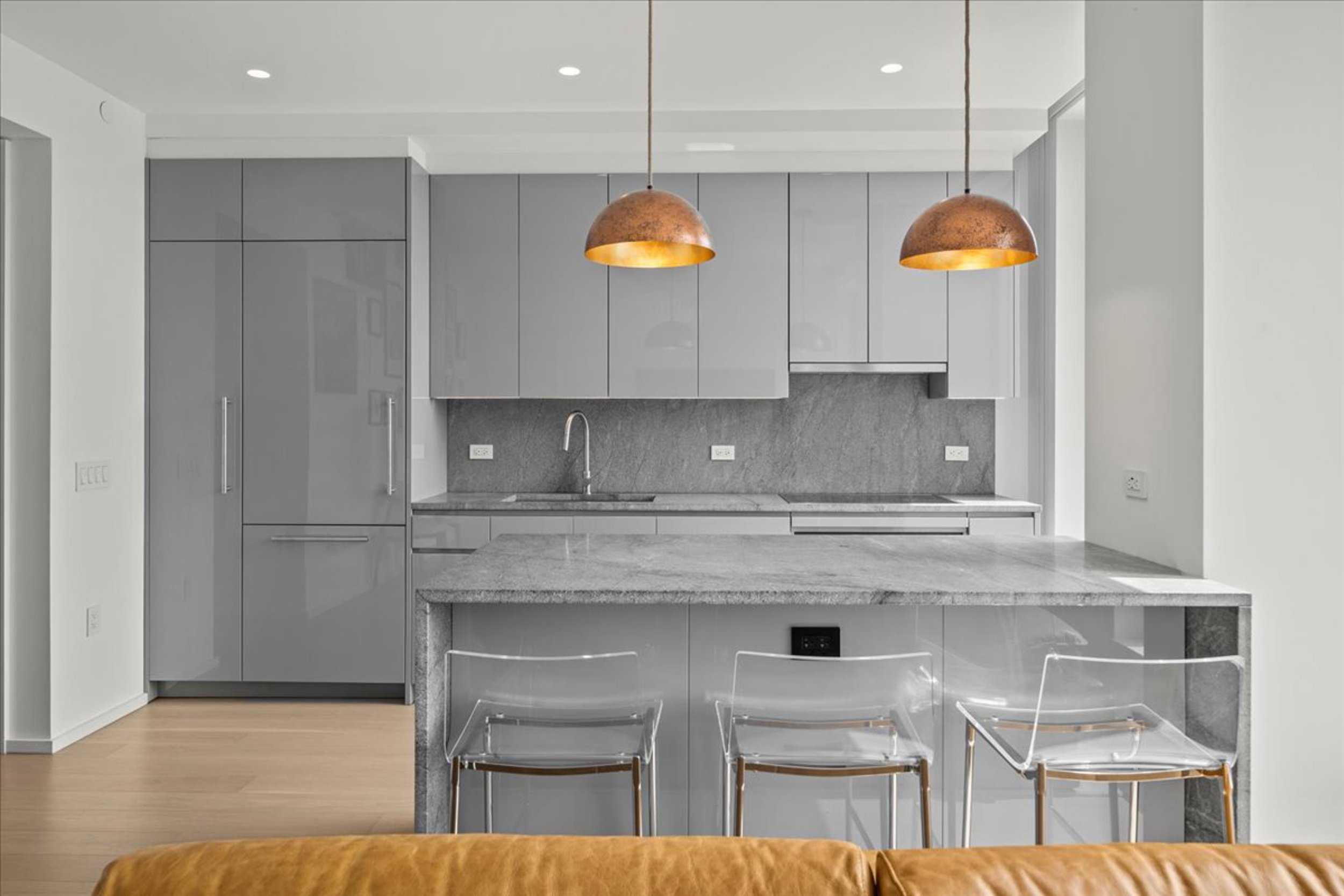 8 South 4th Street, Unit 15D Brooklyn, NY 11249 - Photo 4 of 29 a kitchen with stainless steel appliances granite countertop a stove a sink and a microwave