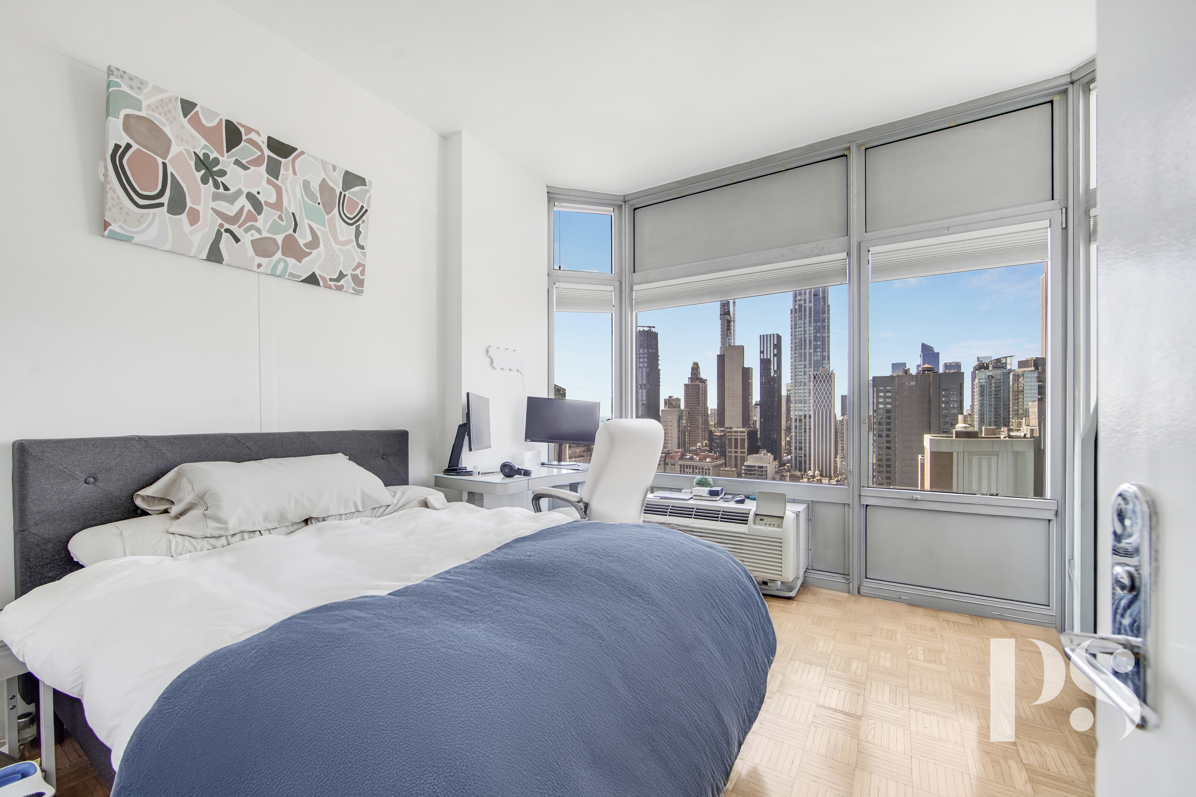 200 East 32nd Street, Unit 33C Manhattan, NY 10016 - Photo 10 of 12 a bedroom with a large bed and a window