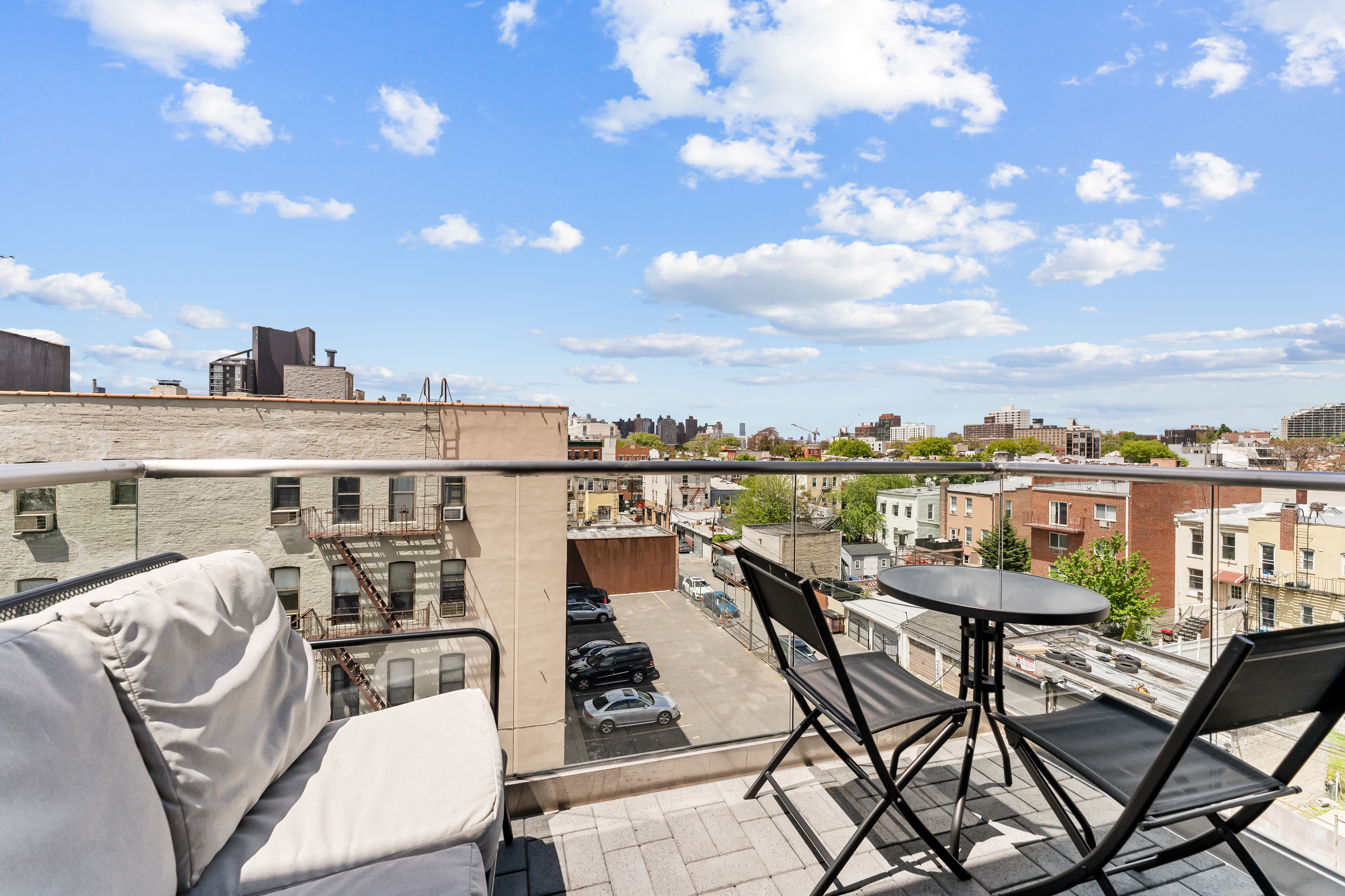 14-33 31st Avenue, Unit H5 Queens, NY 11106 - Photo 8 of 10 a view of a chairs and table in patio