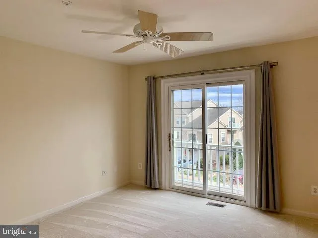 a view of a room with a large window