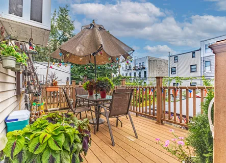 a view of a chairs and table in the patio