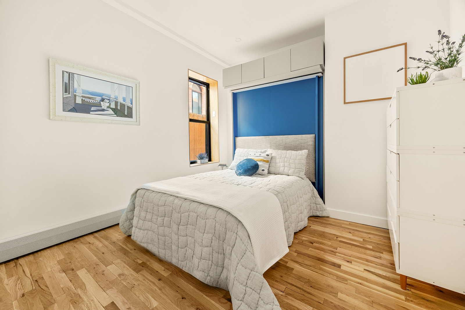 149 Clinton Avenue, Unit 1B Brooklyn, NY 11205 - Photo 6 of 9 a bedroom with a bed and a window