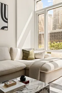 a living room with furniture and a window